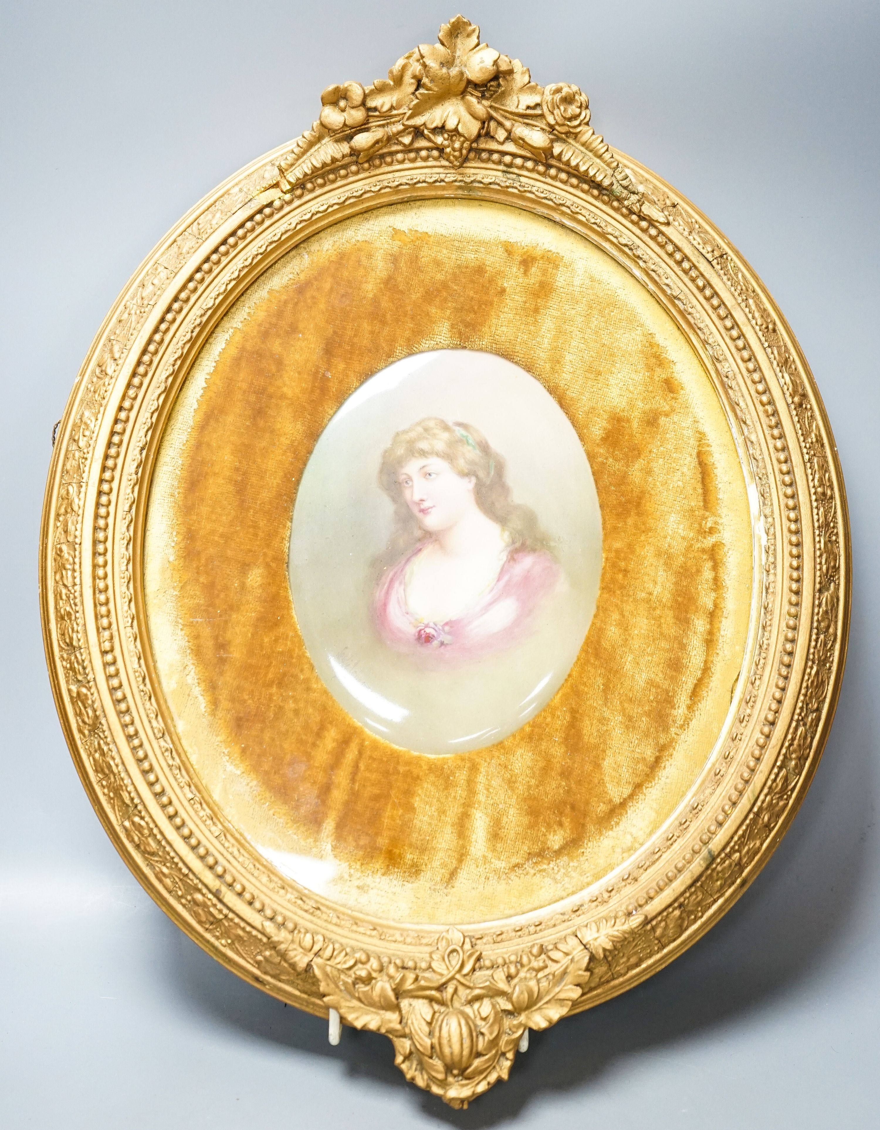 A Royal Doulton oval plaque, signed Leslie Johnson, hand painted with a portrait of a lady, in gesso frame, with velvet mount.